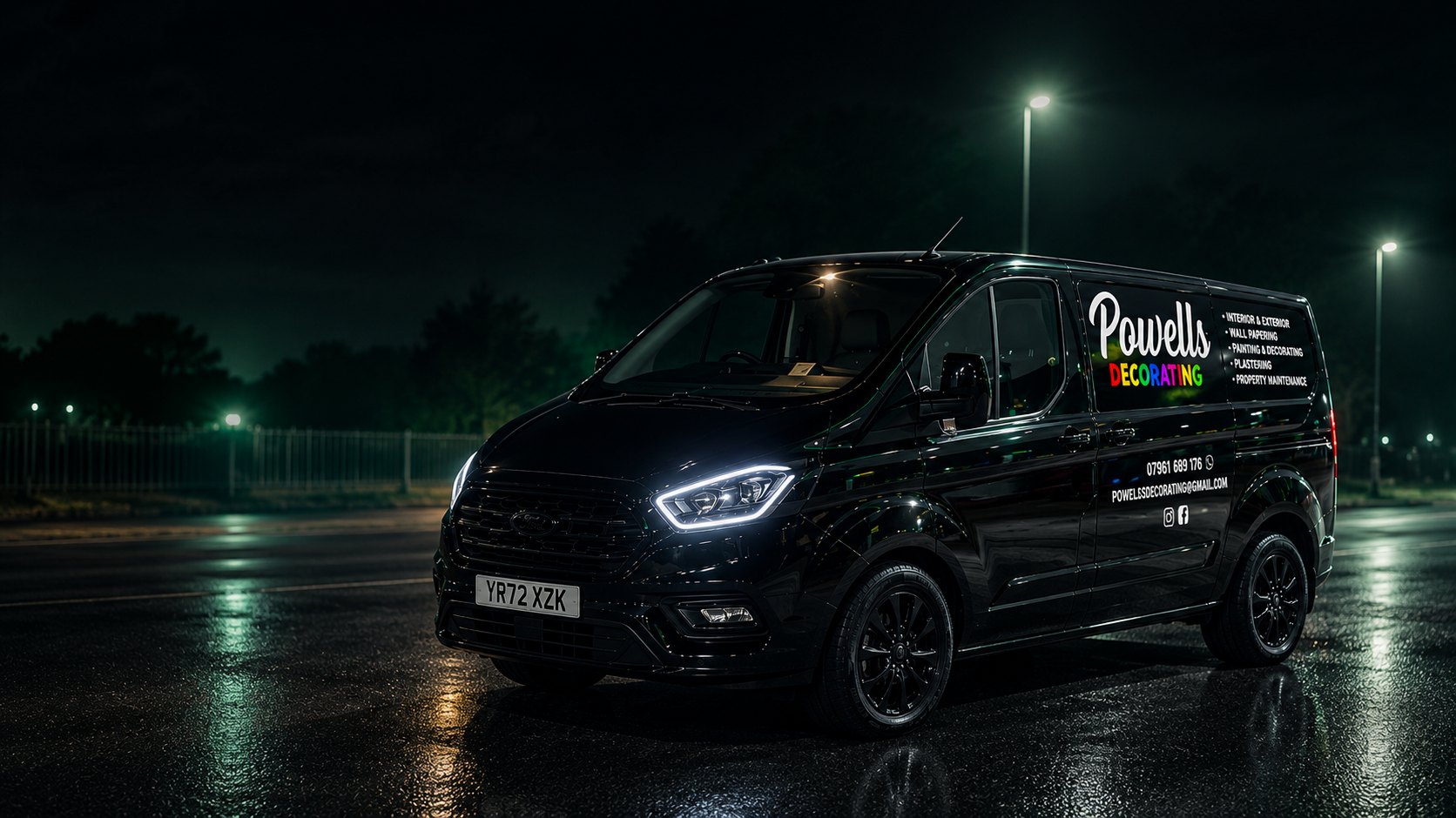The Powell's Decorating black van parked at night